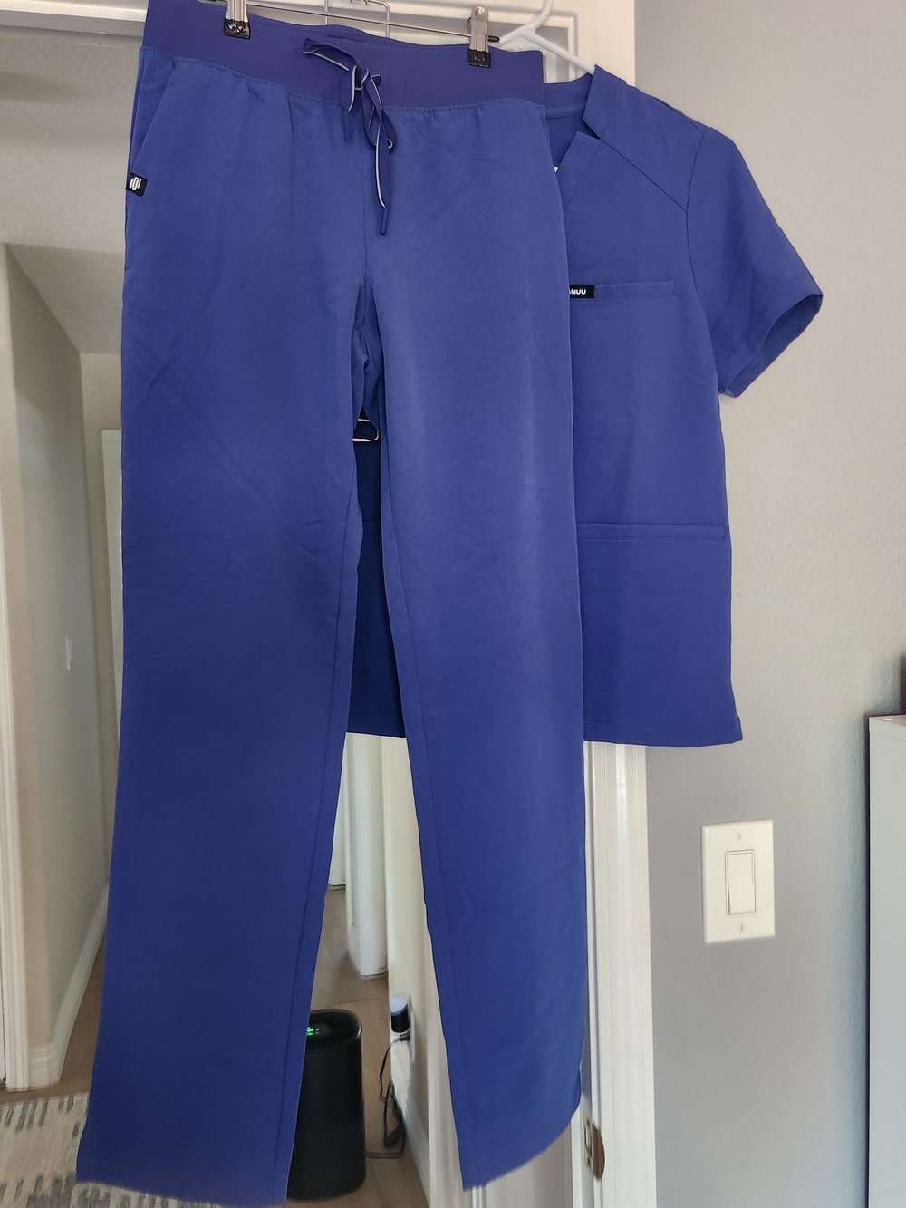 JAANUU Women's Scrub Set in blue. XS scrub top, XS/Tall scrub pant